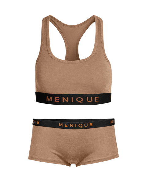 A flat lay of a women's two-piece lounge or activewear set against a white background. The set is a heathered tan color and includes a racerback bralette and matching boy shorts. Both pieces feature a wide, contrasting black elastic band with the brand name "MENIQUE" printed across it in a matching tan color.