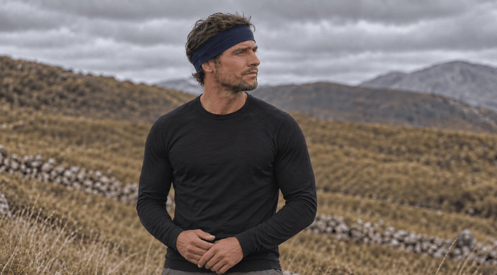 Man wearing unisex sports headband in denim blue  color