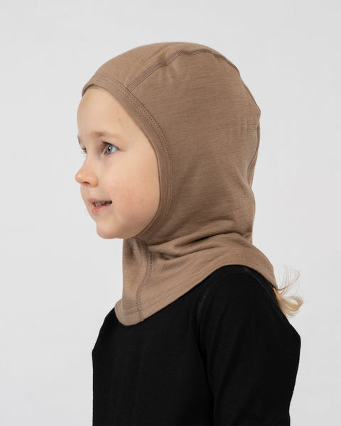 Side view of kids beige merino wool balaclava, lightweight protective layer for cold weather.