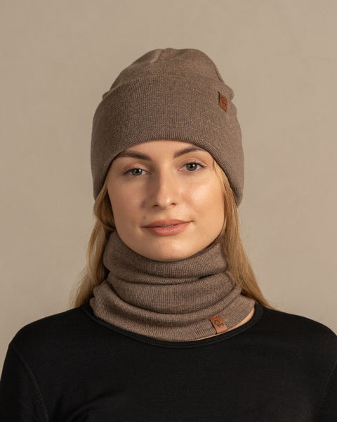 Women wearing knitted merino wool beanie and gaiter in brown color