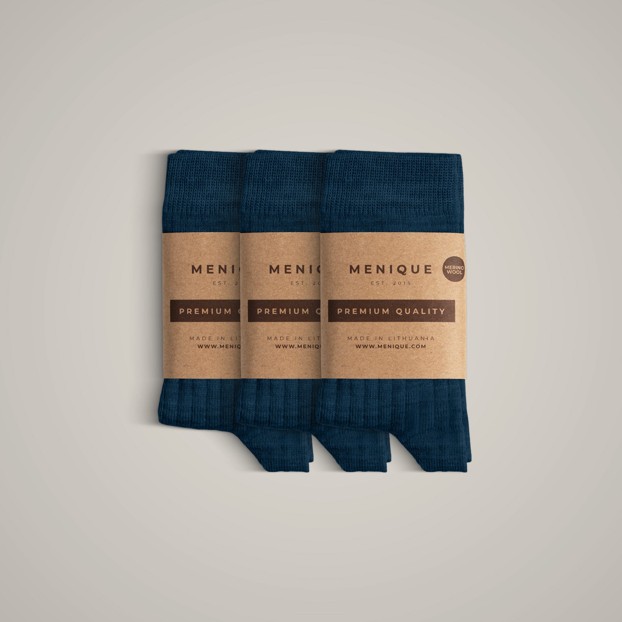 A 3-pack of kids’ pale pink ribbed merino wool socks labeled “Menique Premium Quality.