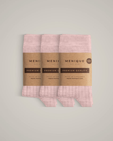 A 3-pack of kids’ pale pink ribbed merino wool socks labeled “Menique Premium Quality.