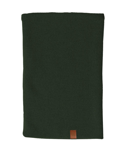 A dark green knit neck gaiter, likely made of merino wool, is displayed against a white background. The gaiter is shown laid flat and has a small brown tag at the bottom.