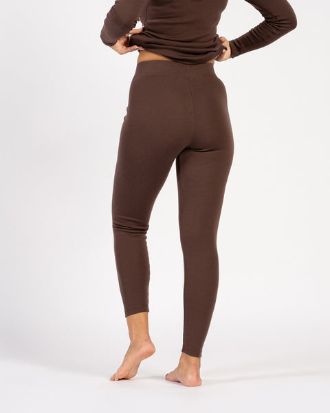 Back view of brown merino wool leggings, seamless high-waist fit.