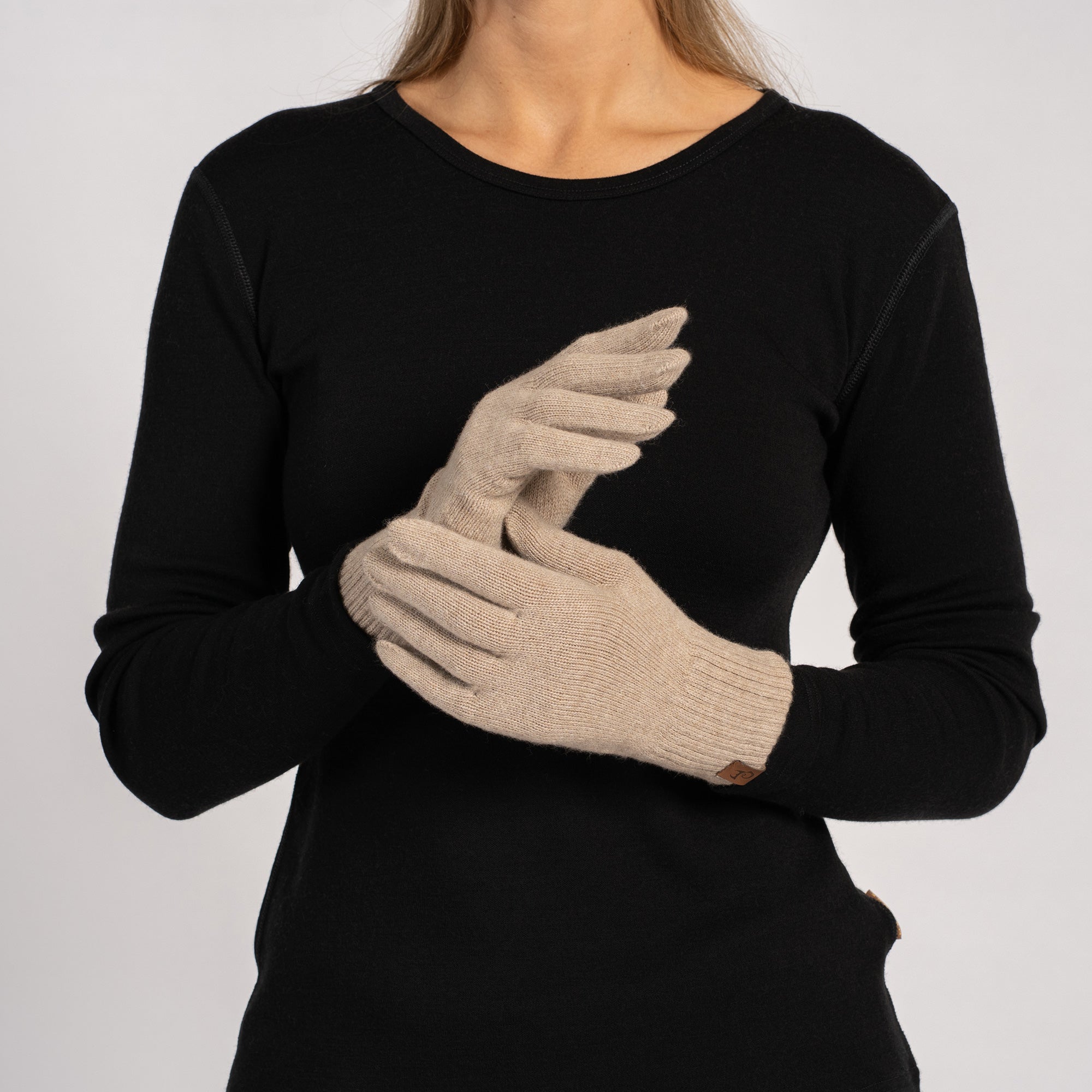 Classic black cashmere short gloves for women, crafted from premium knit. Warm, lightweight, and breathable gloves offering timeless style for cold seasons.